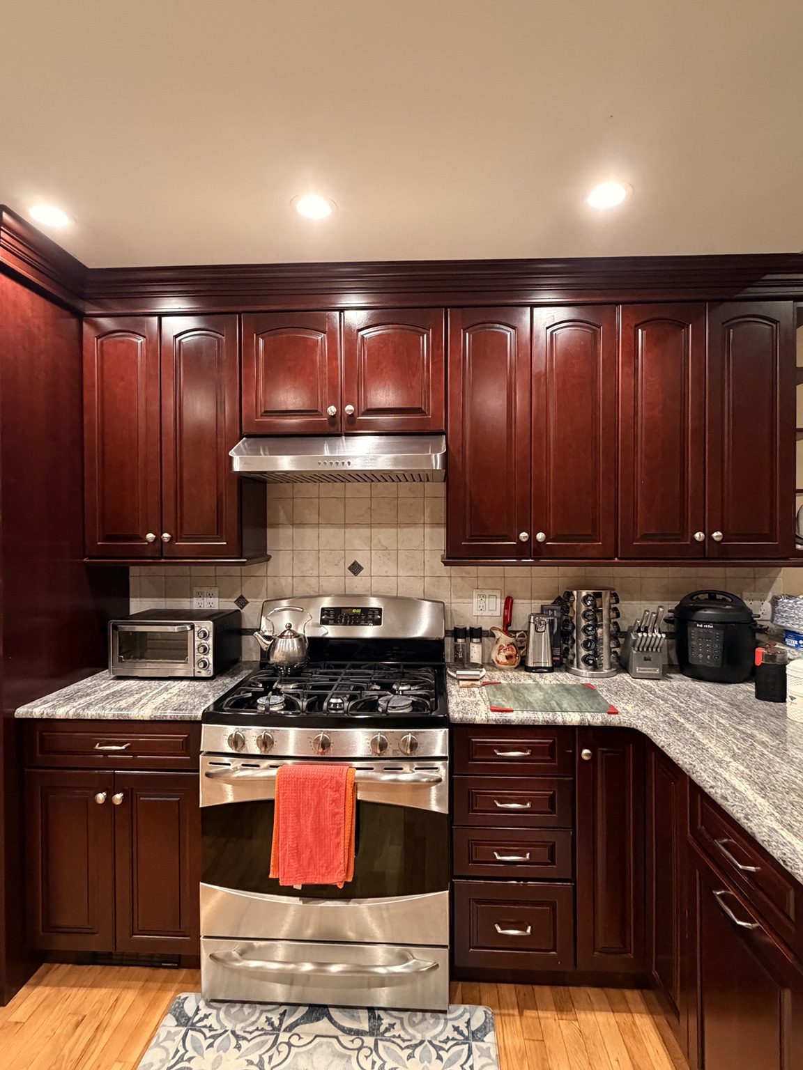 The same stove area with items put away and the counters tidied after the reset